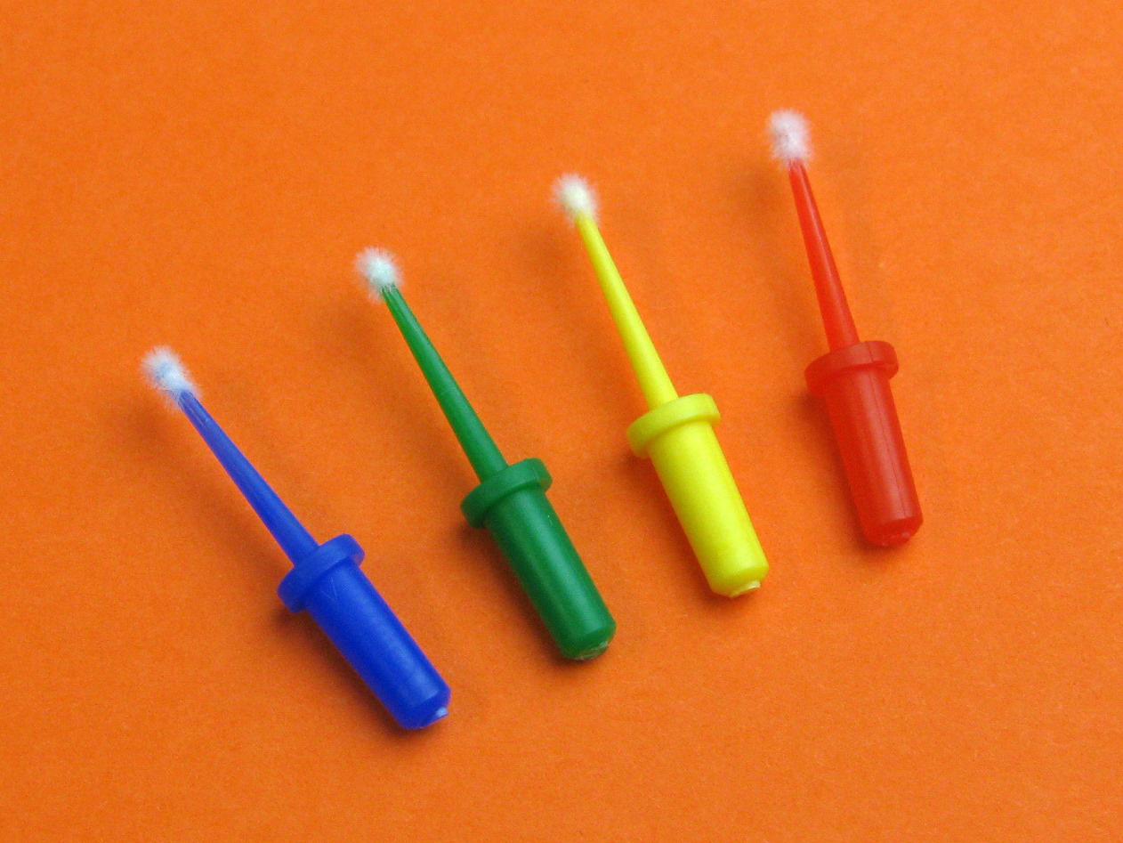 Flocked applicators for applying various liquids.